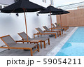 Chair loungers by the pool 59054211