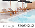 Chair loungers by the pool 59054212