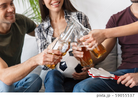 Group of friends sport fans watching soccer match cheers Group of friends sport fans watching soccer match cheers 59055537