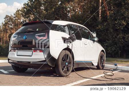 Power cable supply plugged in new electric car 59062129