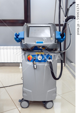 Cosmetology Service. Revolutionizing dynamic laser for hair removal device in clinic close-up Cosmetology Service. Revolutionizing dynamic laser for hair removal device in clinic close-up 59063374