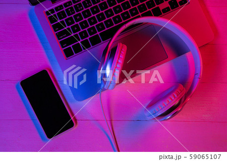 Top view of set of gadgets in purple neon light Top view of set of gadgets in purple neon light 59065107