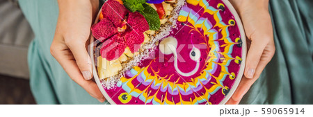 BANNER, LONG FORMAT Young woman having a mediterranean breakfast seated at her sofa and eats Healthy BANNER, LONG FORMAT Young woman having a mediterranean breakfast seated at her sofa and eats Healthy 59065914
