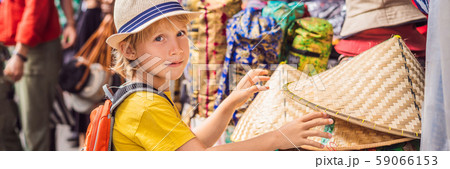 BANNER, LONG FORMAT Boy at a market in Ubud, Bali. Typical souvenir shop selling souvenirs and 59066153
