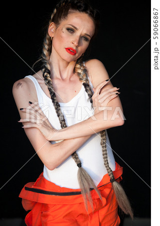 Portrait of a beautiful woman mechanic with two braids 59066867
