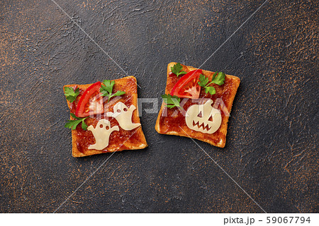 Halloween sandwiches toasts with ghost and pumpkin 59067794
