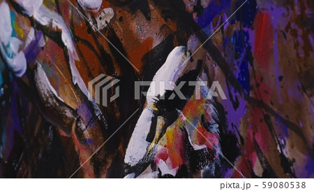 Artist designer draws an eagle on the wall. Craftsman decorator paints a picture with acrylic oil Artist designer draws an eagle on the wall. Craftsman decorator paints a picture with acrylic oil 59080538