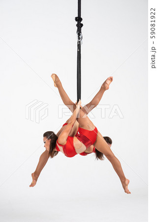 Twins female circus duo on the Aerial hoop isolated on white Twins female circus duo on the Aerial hoop isolated on white 59081922