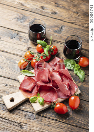Italian antipasto with bresaola and red wine Italian antipasto with bresaola and red wine 59084741