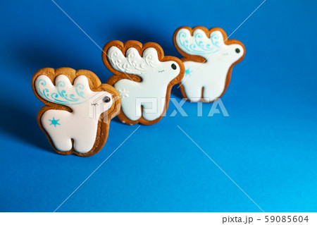 gingerbread cookie of cute deer on blue 59085604