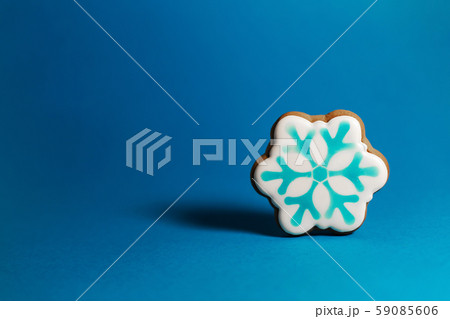 gingerbread cookie of snowflake on blue gingerbread cookie of snowflake on blue 59085606