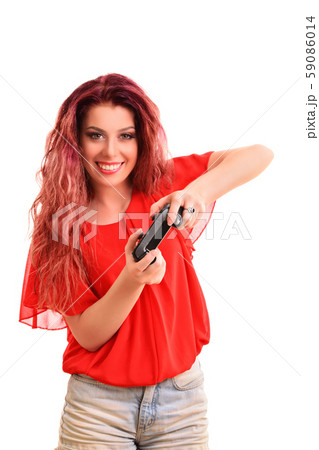 Smiling young girl playing with a game controller 59086014