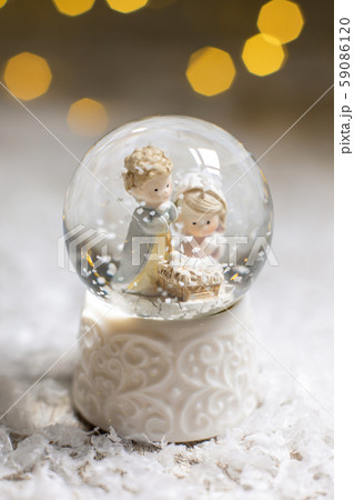 Decorative Christmas-themed figurines. A glass 59086120