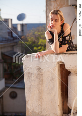 Portrait of a beautiful fashionable blonde woman in a dress with flowers Portrait of a beautiful fashionable blonde woman in a dress with flowers 59087188