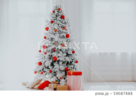 Christmas tree in the white room gifts new year Christmas tree in the white room gifts new year 59087888