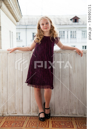 Portrait of a beautiful fashionable girl in a dark dress 59090151