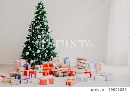 Green Christmas tree with gifts of toys for the new year holiday decor winter Green Christmas tree with gifts of toys for the new year holiday decor winter 59091026