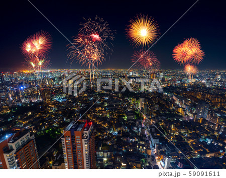 Fireworks over Tokyo cityscape at night, Japan 59091611