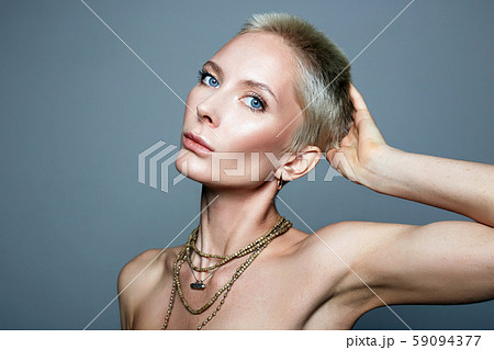 beautiful woman with short blond hair cut. 59094377