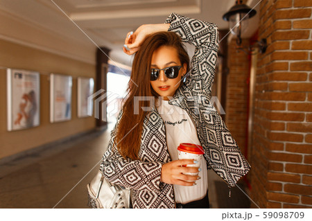 Beautiful young model woman with a coffee 59098709