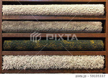 samples of multi-colored carpets on the shelves samples of multi-colored carpets on the shelves 59105337