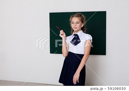 beautiful girl at the school board in class in class 59106030
