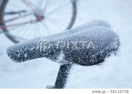 Bicycle covered in frost close-up at winter day Bicycle covered in frost close-up at winter day 59110728