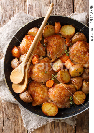 Rustic style chicken thighs baked with potatoes, 59112396