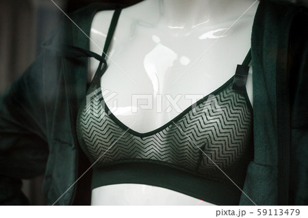 Closeup of green bra on mannequin in fashion store Closeup of green bra on mannequin in fashion store 59113479