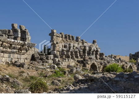 Ruins of the ancient city of Side and the Amphitheatre photo with the bird flight. Ruins of the ancient city of Side and the Amphitheatre photo with the bird flight. 59115127