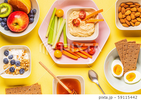 Healthy snack on a pastel background. 59115442