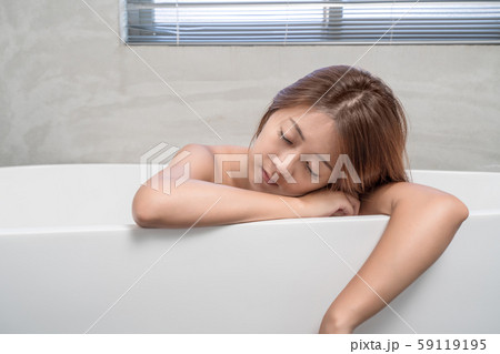 Young and beautiful girl using phone relaxing in 59119195