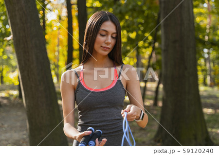 Pretty lady taking her stuff home after workout 59120240