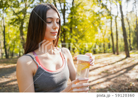 Pretty woman preparing to drinking her water Pretty woman preparing to drinking her water 59120360