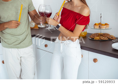 Two young people touching glasses with wine 59120933