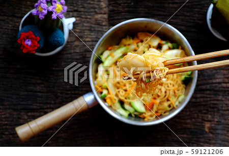 human hand mix instant noodles with vegetables for quick vegan breakfast human hand mix instant noodles with vegetables for quick vegan breakfast 59121206