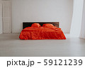 the Interior of the white room with a bed with red 59121239