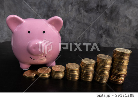 blue piggy bank with coins bar graph, step up growing business to success and saving for retirement concept blue piggy bank with coins bar graph, step up growing business to success and saving for retirement concept 59121289