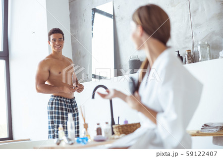 Positive delighted man is demonstrating his smile Positive delighted man is demonstrating his smile 59122407