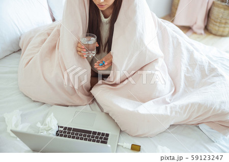 Focused photo on sick female that taking pills Focused photo on sick female that taking pills 59123247