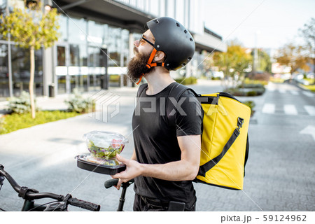 Courier delivering takeaway food 59124962