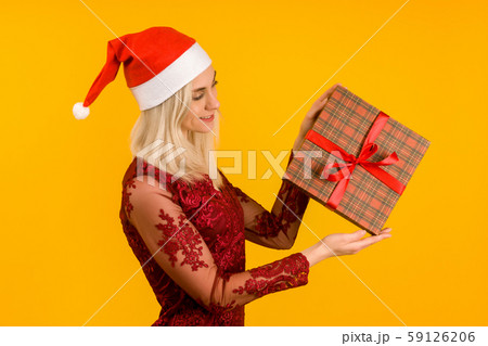 A beautiful sexy girl in a New Year's hat and gray 59126206