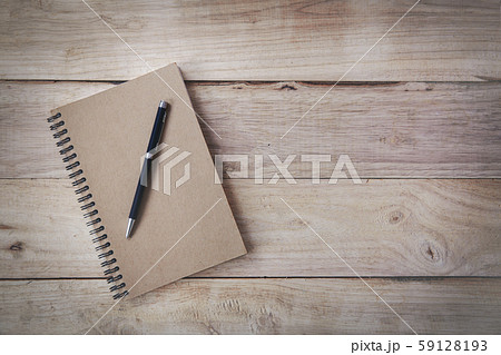 Top view book with blank pages and pen on wooden background 59128193