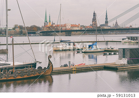 Vintage boat on Riga panorama background 59131013