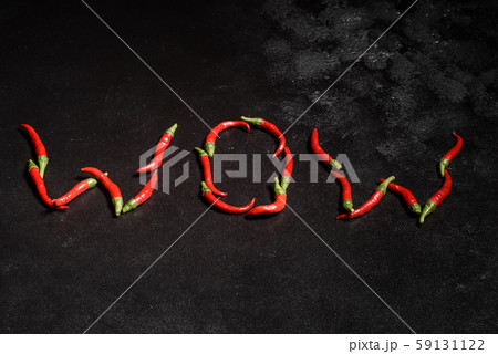 Bright red chilli pepper on a grey concrete background 59131122
