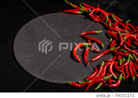 Bright red chilli pepper on a grey concrete background 59131131