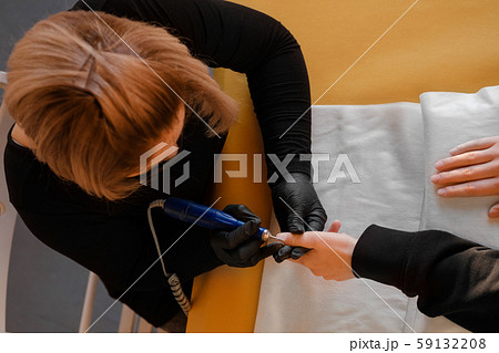 Manicure, cleaning of nails by a milling cutter. 59132208