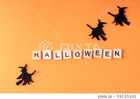 Halloween holiday minimal top view image of letter with text and whitch. Holiday background Halloween holiday minimal top view image of letter with text and whitch. Holiday background 59135142