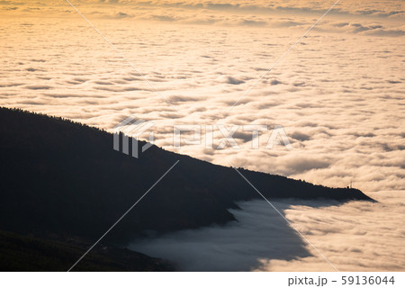 sea of clouds below the summit of Teide volcano in Tenerife sea of clouds below the summit of Teide volcano in Tenerife 59136044
