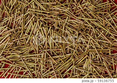 Texture of yellow nails on red background. Texture of yellow nails on red background. 59136755